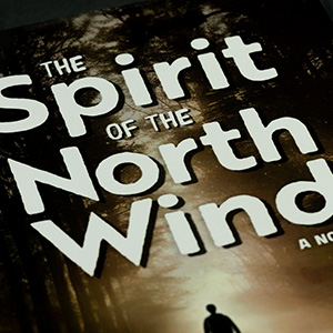 A closeup of the cover showing the title lockup with the words "The Spirit of the North Wind"