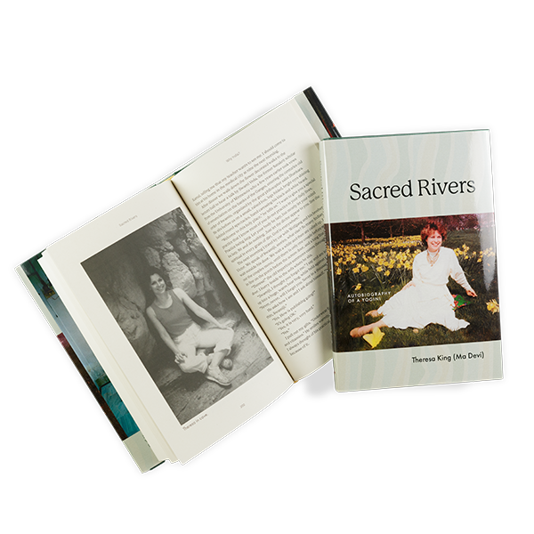 Dust jacketed cover and open to sample spread of "Sacred Rivers" book. Cover features an old photo of author in a white dress sitting among yellow flowers, while the interior spread shows the author in black and white sitting cross legged.